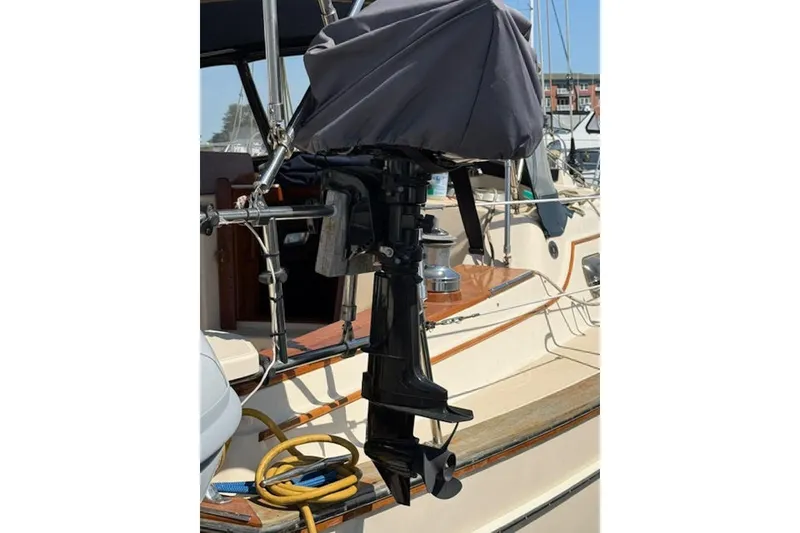 Slide: The Image of Covered outboard motor on 2001 Island Packet 380 sailboat deck. - 5