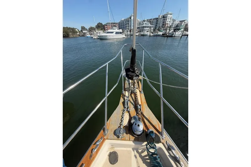 Slide: The Image of Bow view of 2001 Island Packet 380 sailboat docked in a marina. - 8