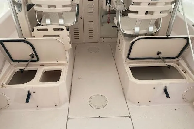 Slide: The Image of 2006 Grady White SEAFARER boat interior with open storage compartments and seating. - 14
