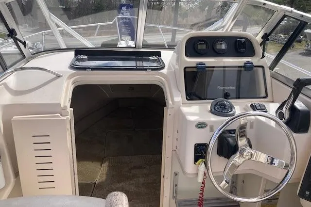 Slide: The Image of 2006 Grady White SEAFARER boat interior with steering wheel and navigation equipment. - 5
