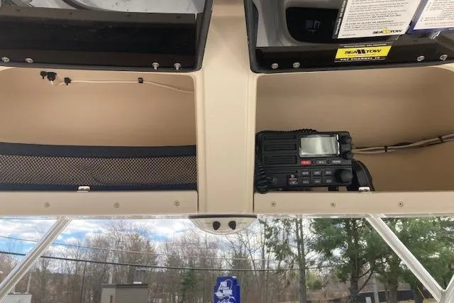 Slide: The Image of 2006 Grady White SEAFARER boat interior with radio equipment and storage compartments. - 6