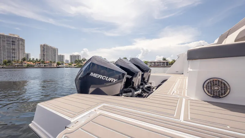 Slide: The Image of 2021 Cruisers Yachts 38 GLS with Mercury engines on a sunny waterfront. - 20