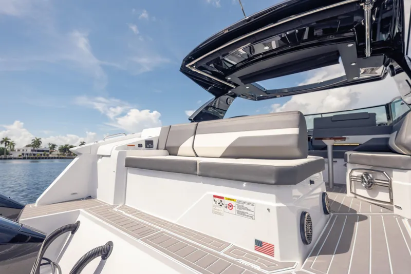 Slide: The Image of 2021 Cruisers Yachts 38 GLS luxury boat interior with seating and open sky view. - 23