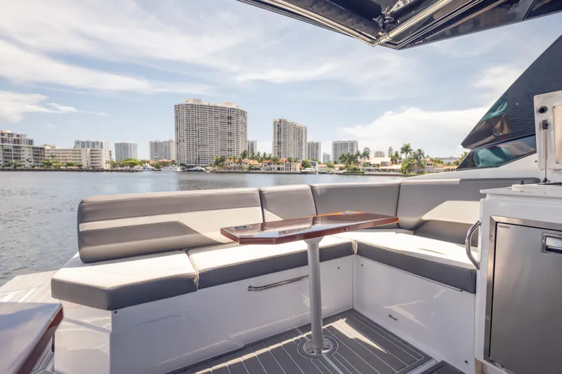 Slide: The Image of Luxurious 2021 Cruisers Yachts 38 GLS interior with waterfront cityscape view. - 25