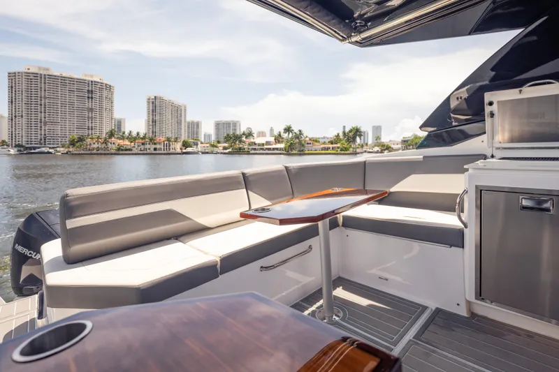 Slide: The Image of Luxurious 2021 Cruisers Yachts 38 GLS interior with waterfront cityscape view. - 26