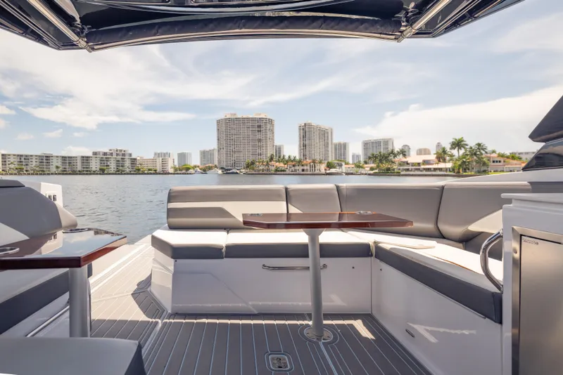 Slide: The Image of 2021 Cruisers Yachts 38 GLS interior with waterfront cityscape view. - 27