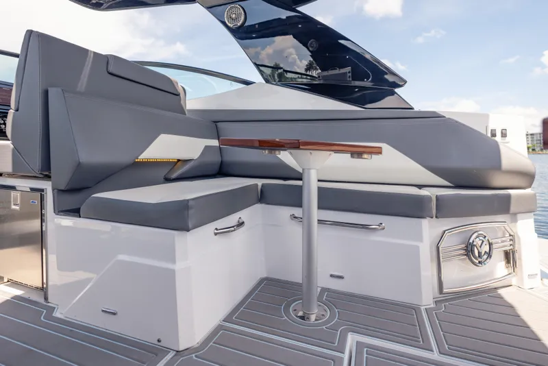 Slide: The Image of 2021 Cruisers Yachts 38 GLS interior with sleek seating and modern table design. - 28