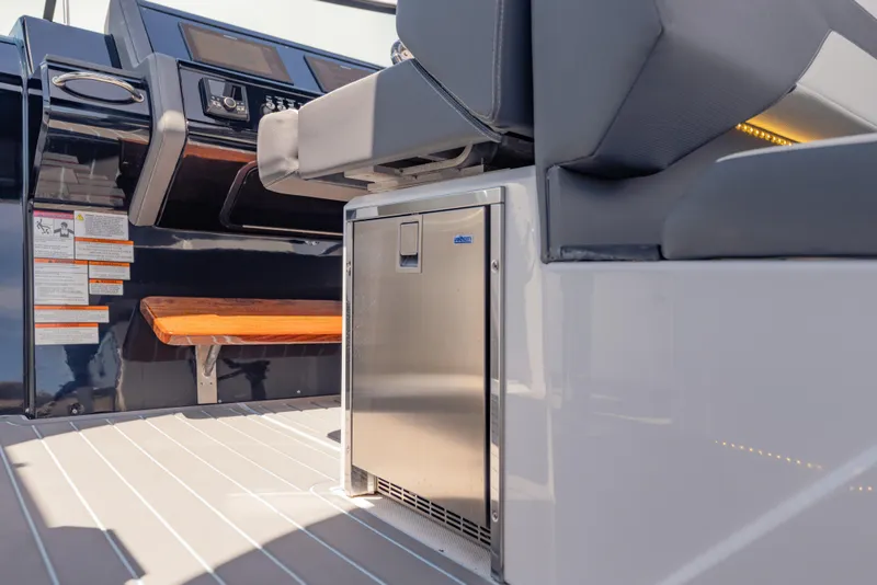 Slide: The Image of 2021 Cruisers Yachts 38 GLS interior with seating and stainless steel mini-fridge. - 31