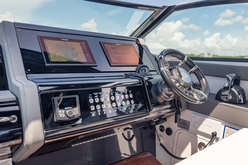 Slide: The Image of Helm of 2021 Cruisers Yachts 38 GLS with modern navigation displays and controls. - 34
