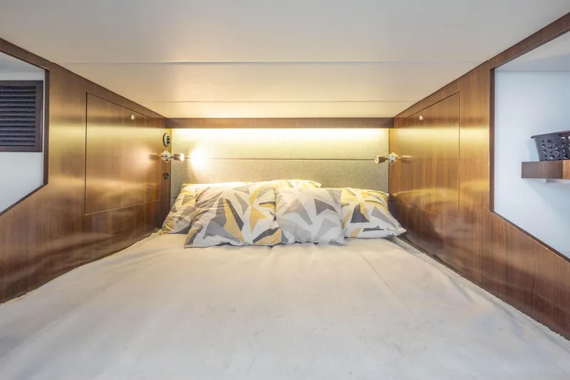 Slide: The Image of Luxurious cabin interior of 2021 Cruisers Yachts 38 GLS with modern bedding. - 37