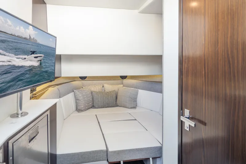 Slide: The Image of Interior of 2021 Cruisers Yachts 38 GLS with cozy seating and mounted TV. - 39