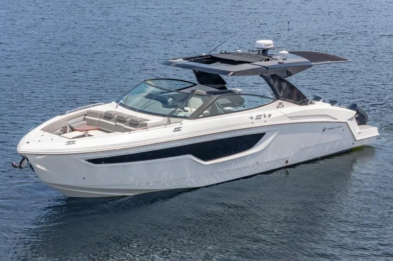 Slide: The Image of 2021 Cruisers Yachts 38 GLS on calm water, showcasing sleek design and luxury features. - 4