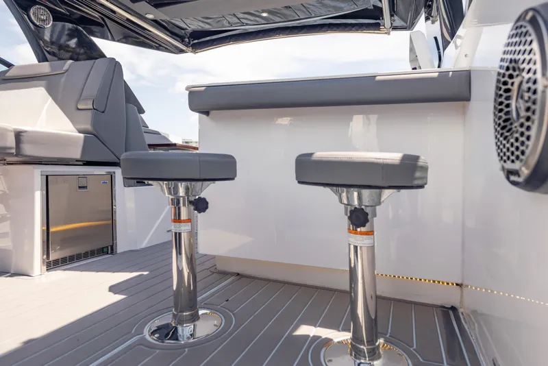 Slide: The Image of 2021 Cruisers Yachts 38 GLS interior with modern seating and sleek design elements. - 42