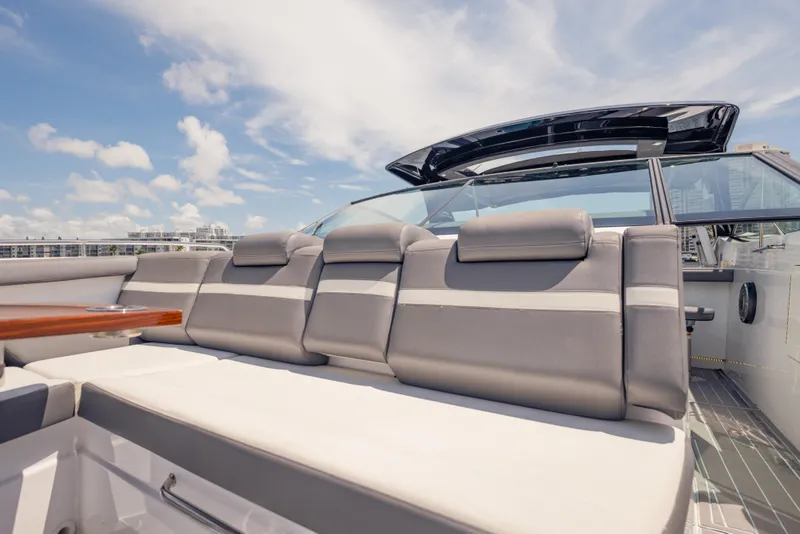Slide: The Image of 2021 Cruisers Yachts 38 GLS luxury seating area under clear blue sky. - 45