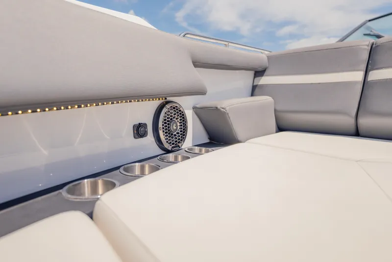 Slide: The Image of Luxurious seating area on 2021 Cruisers Yachts 38 GLS with cup holders and speaker. - 48