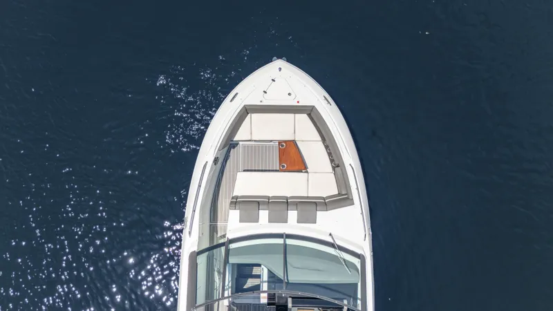 Slide: The Image of Aerial view of 2021 Cruisers Yachts 38 GLS on calm water. - 7