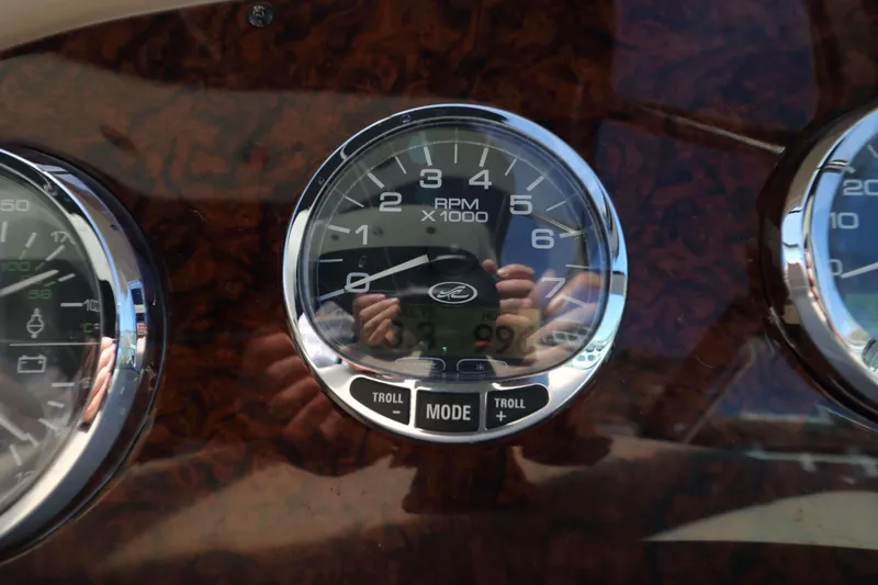 Slide: The Image of Close-up of 2004 Sea Ray Sundancer 320 tachometer, showing RPM gauge and controls. - 10