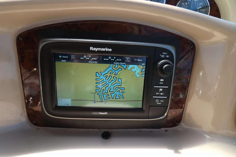 Slide: The Image of Raymarine navigation system on 2004 Sea Ray Sundancer 320 boat dashboard. - 11