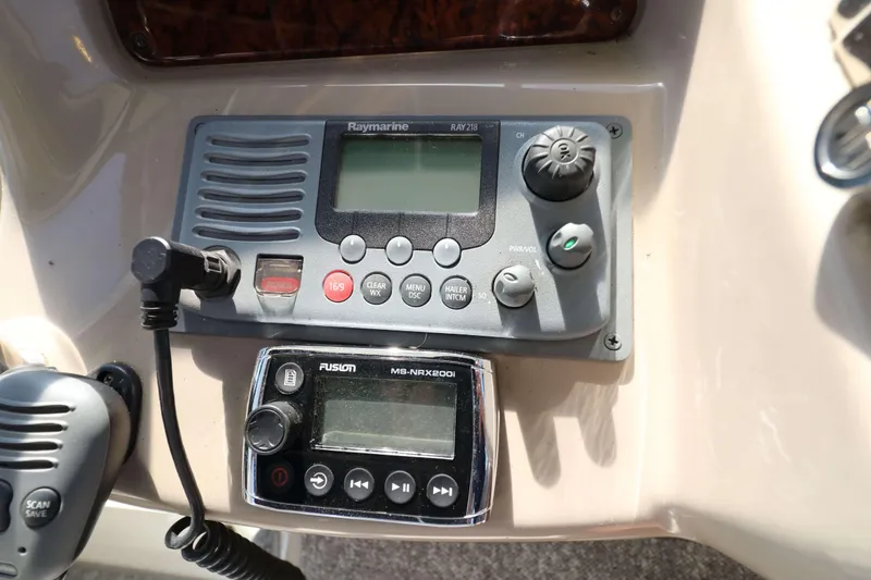 Slide: The Image of Control panel of a 2004 Sea Ray Sundancer 320 with Raymarine and Fusion systems. - 13