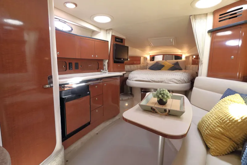 Slide: The Image of Luxurious interior of 2004 Sea Ray Sundancer 320 yacht with cozy seating and modern amenities. - 15