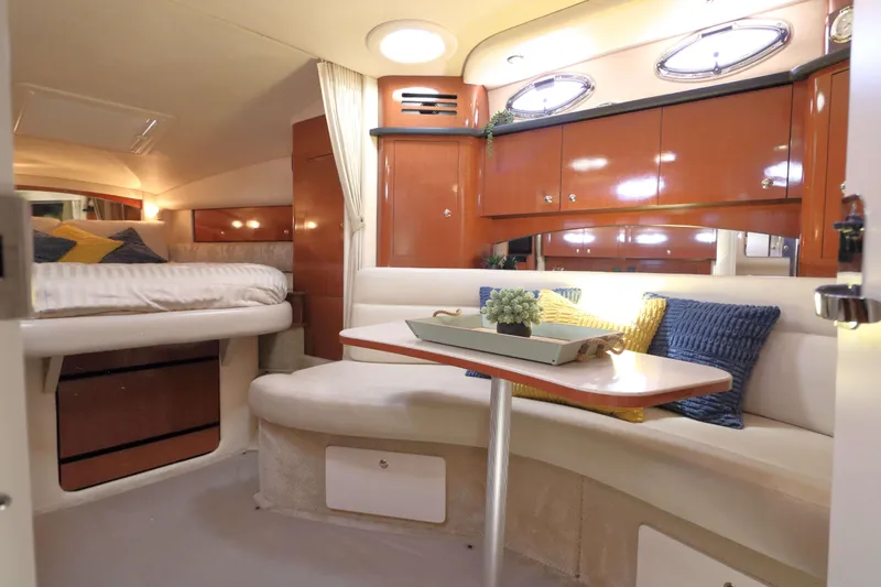 Slide: The Image of Interior of 2004 Sea Ray Sundancer 320 yacht with cozy seating and elegant wood cabinetry. - 16