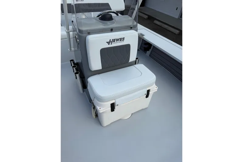 Slide: The Image of 2023 Hewes Redfisher 21 boat seat with integrated cooler and rod holders. - 12