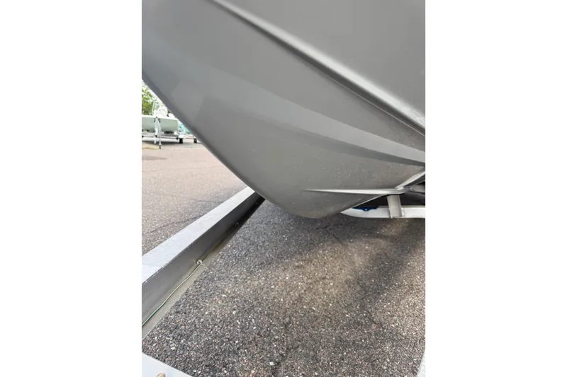 Slide: The Image of 2023 Hewes Redfisher 21 boat hull on trailer, close-up view. - 6