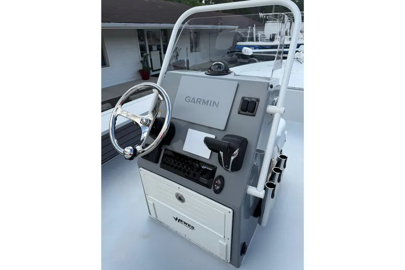 Slide: The Image of 2023 Hewes Redfisher 21 boat console with Garmin navigation system and steering wheel. - 8