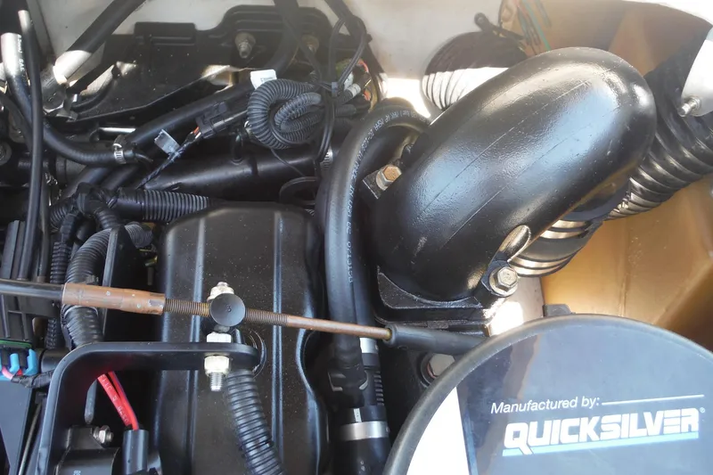Slide: The Image of Engine components of a 2004 Sea Ray 180 Sport boat, featuring Quicksilver parts. - 14