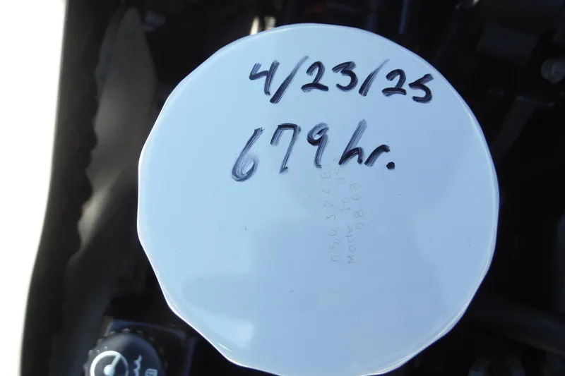 Slide: The Image of Oil filter with handwritten date and hours for 2004 Sea Ray 180 Sport. - 16