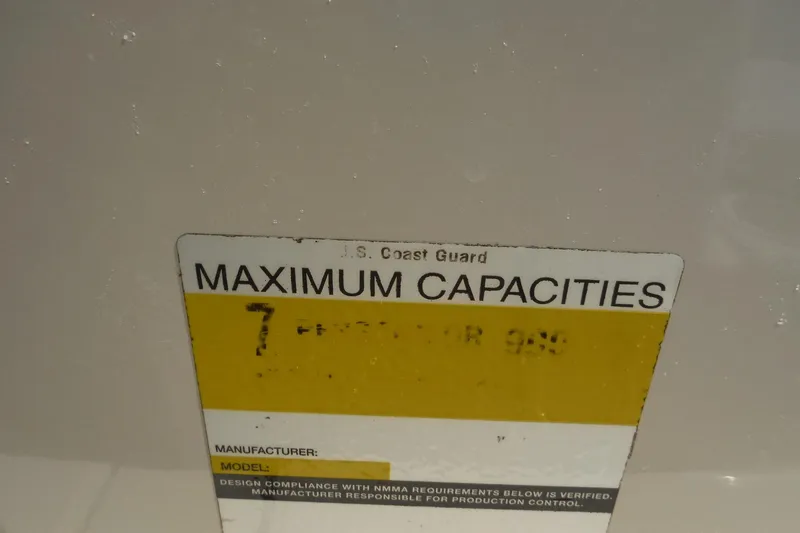 Slide: The Image of Maximum capacities label on 2004 Sea Ray 180 Sport boat. - 18