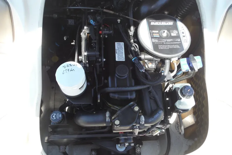 Slide: The Image of Engine of a 2004 Sea Ray 180 Sport boat, showcasing detailed components. - 19