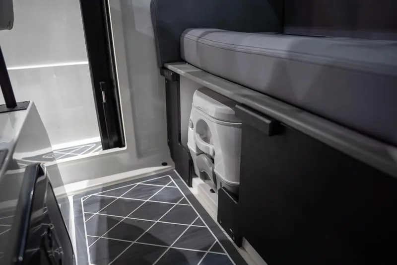 Slide: The Image of Interior of 2026 Iron 907 Coupe featuring compact seating and storage area. - 11