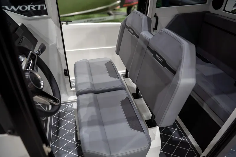 Slide: The Image of Interior of 2026 Iron 907 Coupe showcasing modern gray seating and sleek design. - 12