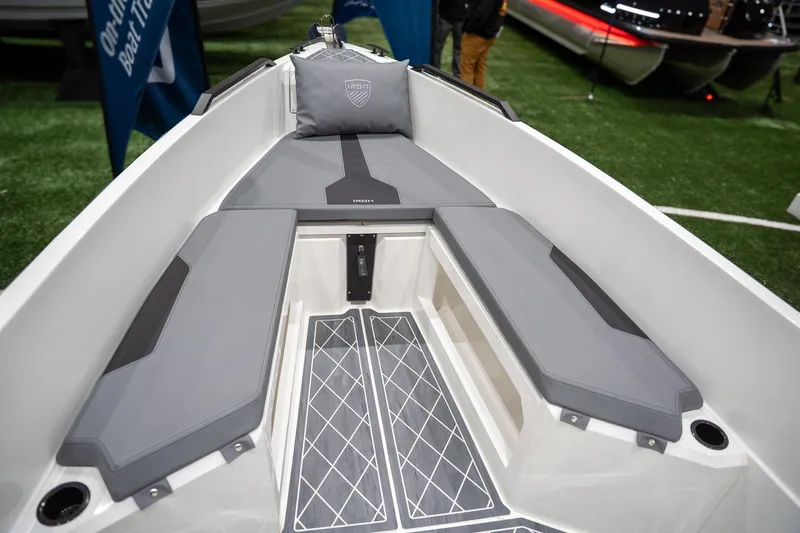 Slide: The Image of 2026 Iron 907 Coupe boat interior with sleek gray seating and modern design. - 14
