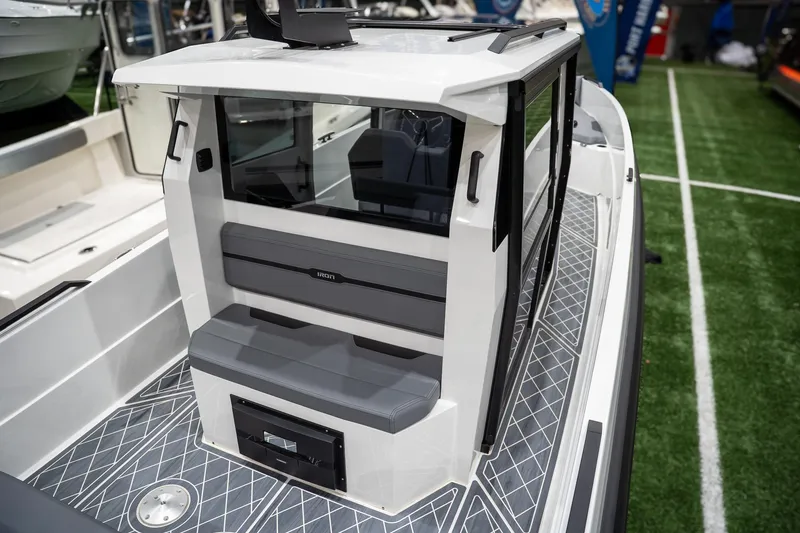 Slide: The Image of 2026 Iron 907 Coupe boat interior with sleek seating and modern design. - 2