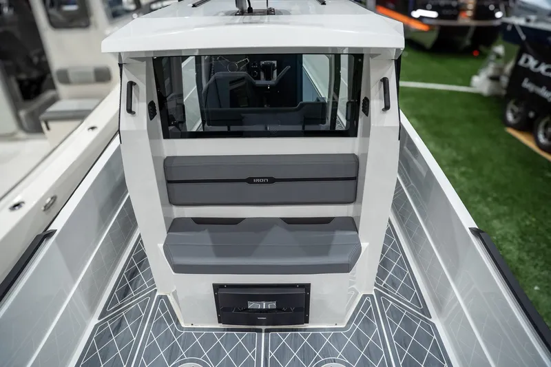 Slide: The Image of 2026 Iron 907 Coupe boat interior with modern seating and sleek design. - 5
