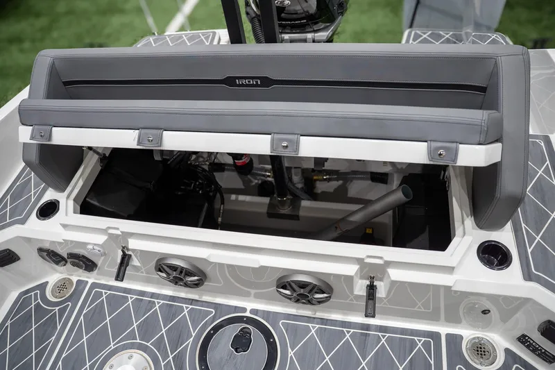 Slide: The Image of 2026 Iron 907 Coupe boat interior with open storage compartment and modern design features. - 6