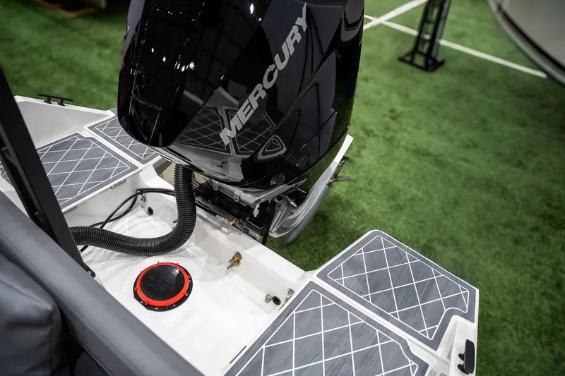 Slide: The Image of 2026 Iron 907 Coupe with Mercury outboard motor on display. - 7