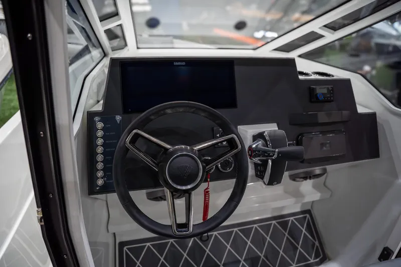 Slide: The Image of Interior dashboard of 2026 Iron 907 Coupe, featuring modern steering and controls. - 9