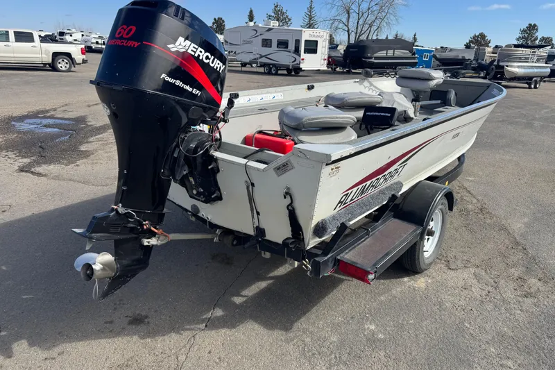 Slide: The Image of 2002 Alumacraft Yukon 165 boat with Mercury 60 FourStroke EFI engine on trailer. - 3