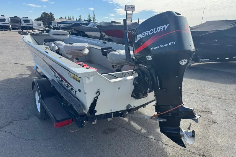 Slide: The Image of 2002 Alumacraft Yukon 165 boat with Mercury FourStroke EFI engine on trailer. - 4