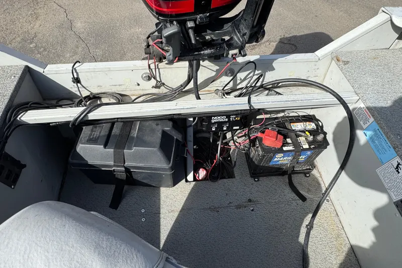 Slide: The Image of 2002 Alumacraft Yukon 165 boat interior with battery setup and wiring. - 8