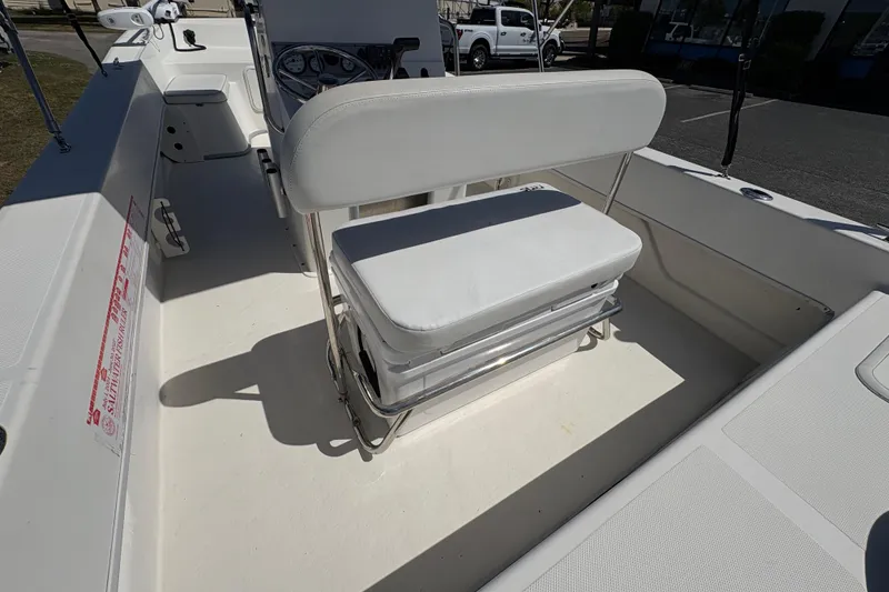 Slide: The Image of 2014 Sundance B20CCR boat interior with white seating and steering console. - 10