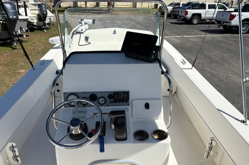 Slide: The Image of 2014 Sundance B20CCR boat console with steering wheel and Garmin navigation system. - 12