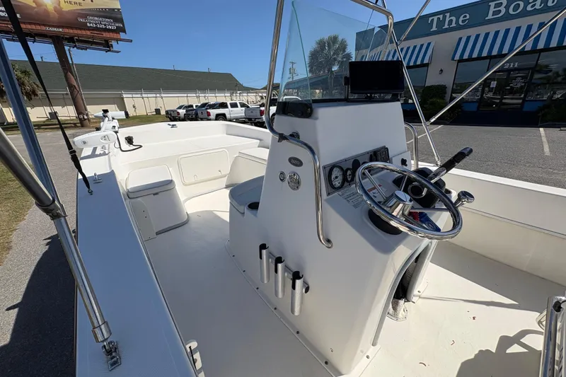 Slide: The Image of 2014 Sundance B20CCR boat interior with steering console and seating. - 14