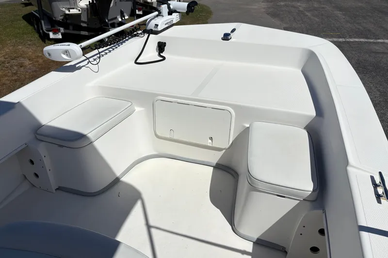 Slide: The Image of 2014 Sundance B20CCR boat interior with seating and storage compartments. - 17