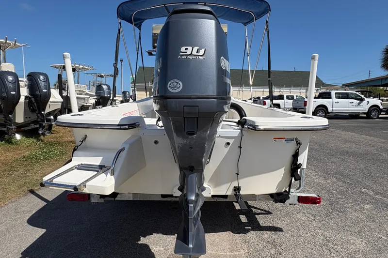 Slide: The Image of Rear view of a 2014 Sundance B20CCR boat with Yamaha 90 engine. - 2