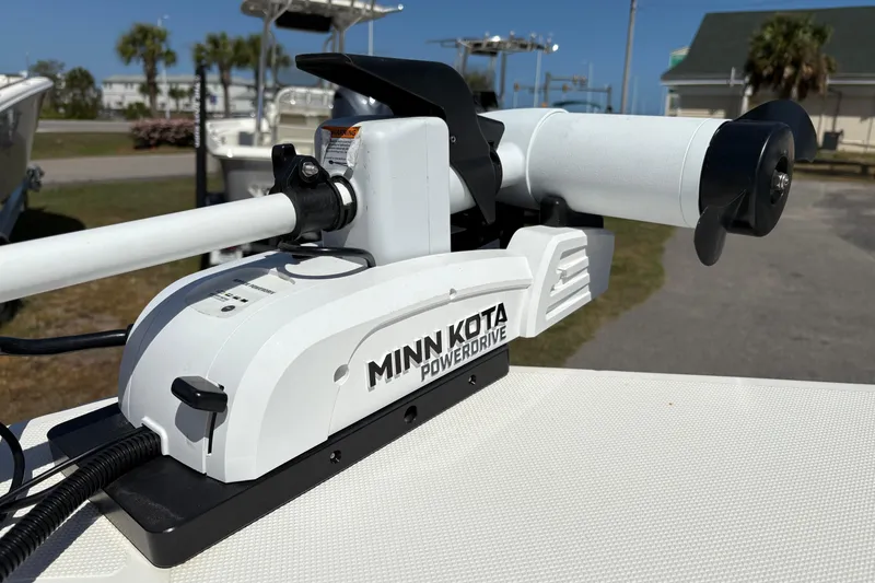 Slide: The Image of Minn Kota PowerDrive motor on 2014 Sundance B20CCR boat, outdoor setting. - 21
