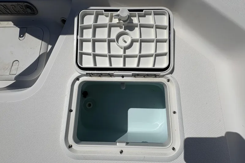 Slide: The Image of Open storage compartment on 2014 Sundance B20CCR boat deck. - 8